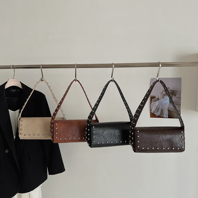 Women's Simple Personality Rivet Pouch Early Spring Niche Handbags