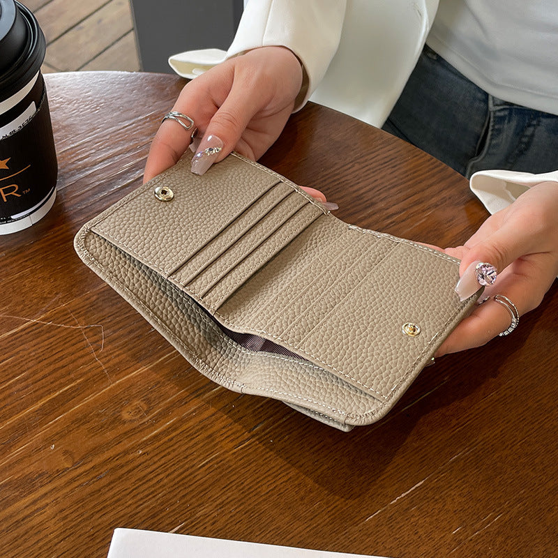 Women's First Layer Cowhide Thin Half Fold Short Compact Coin Purses