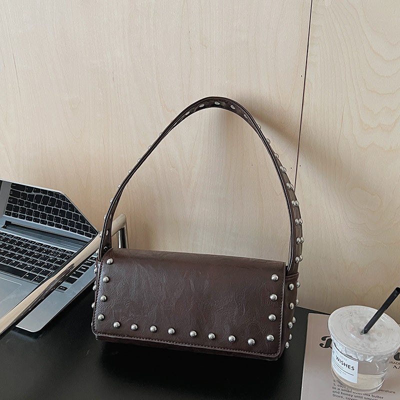 Women's Simple Personality Rivet Pouch Early Spring Niche Handbags