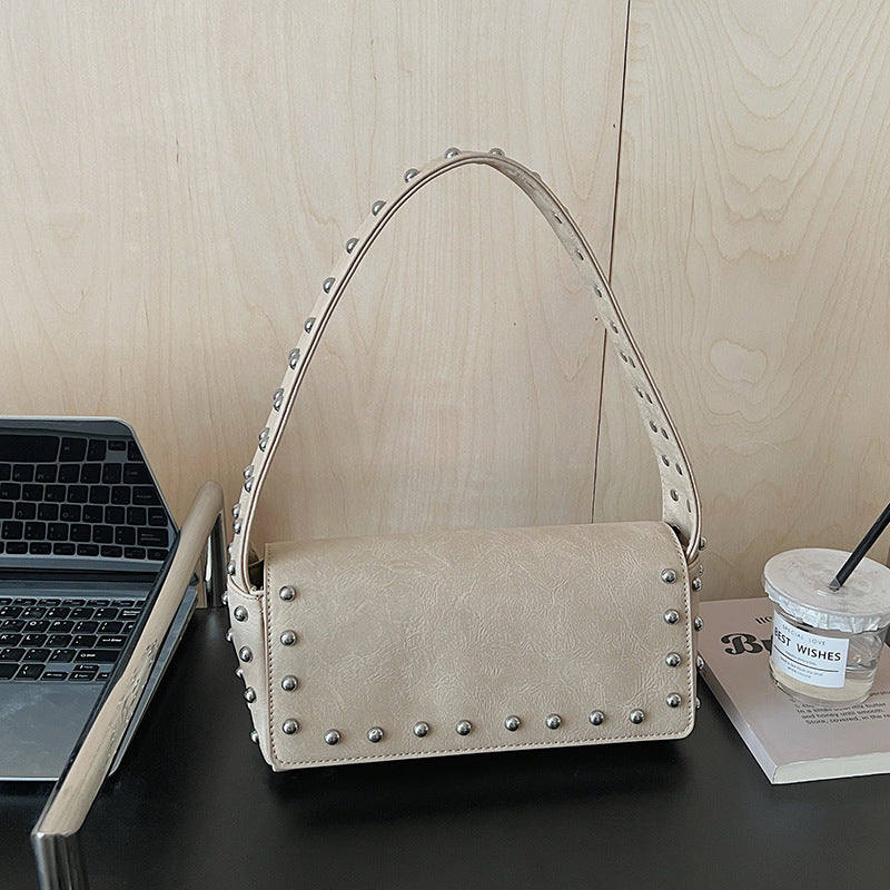 Women's Simple Personality Rivet Pouch Early Spring Niche Handbags