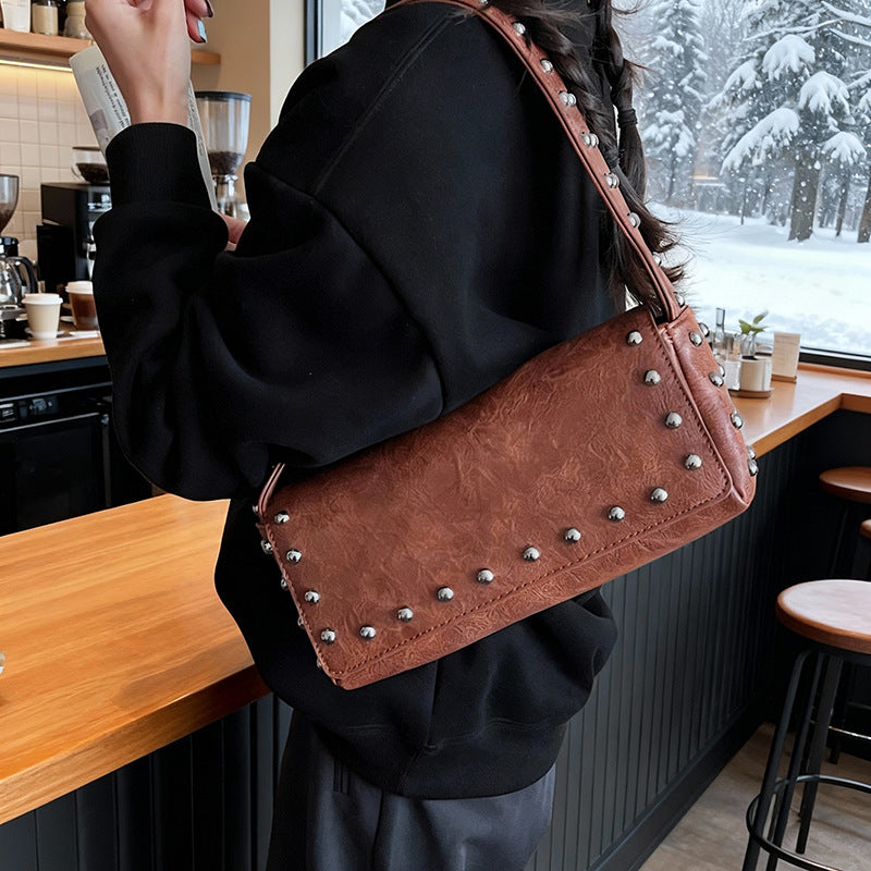 Women's Simple Personality Rivet Pouch Early Spring Niche Handbags